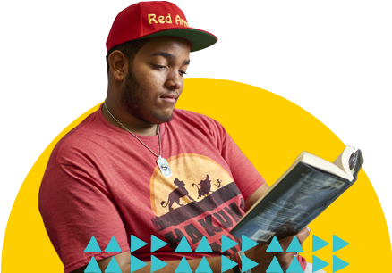 A teen patron reading.